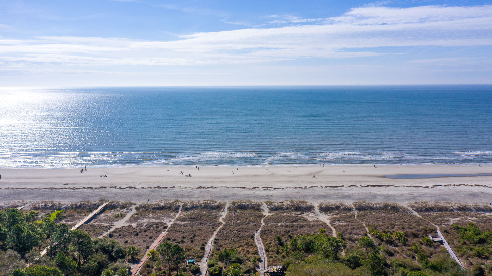 Luxury Hilton Head beach compound with guest house, pool, balconies, and second-row ocean access.